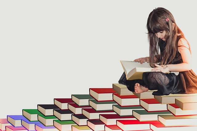 girl-sitting-on-a-pile-of-books