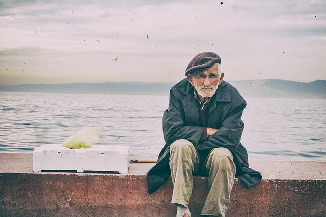 old-man-tired-sitting-on-the-pier