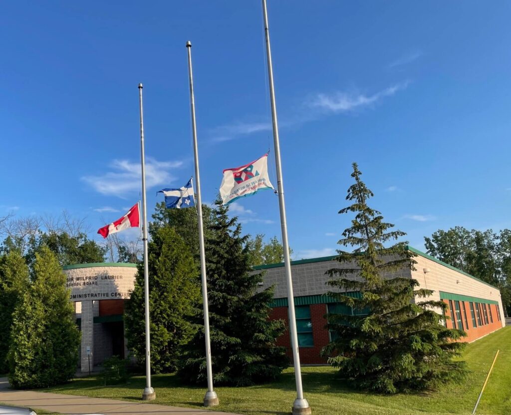 flags-at-half-staff-in-front-of-the-school